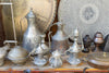 A collection of elaborate silver tea pots for sale