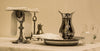 A collection of silver holloware including a silver vase.