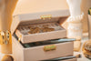 Gold earrings in an open jewellery box
